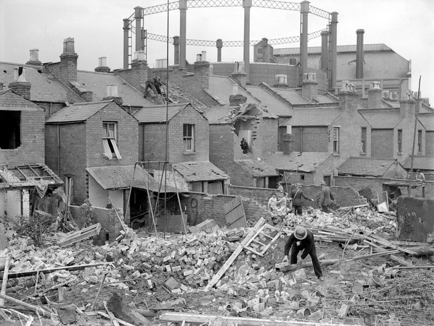 Black and white image of damaged buildings and rubble during World War 2