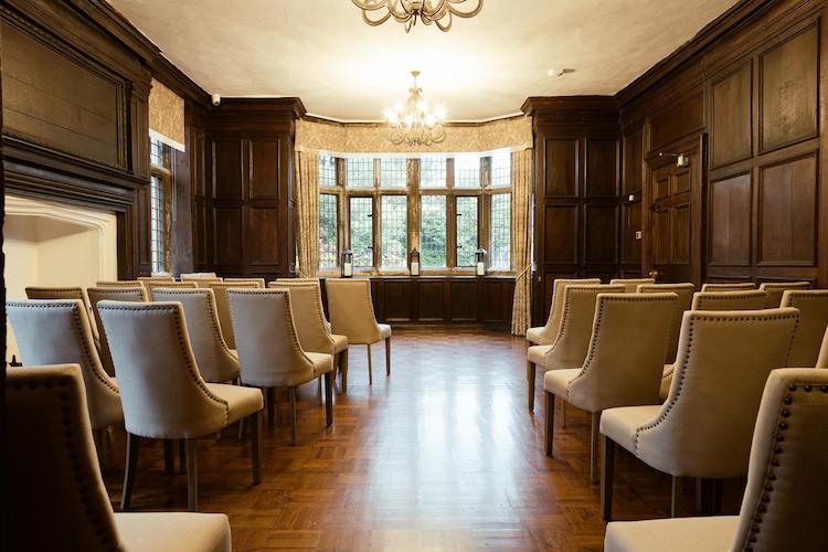 Image of ceremony room in St Johns House - seats lined up pointing towards window