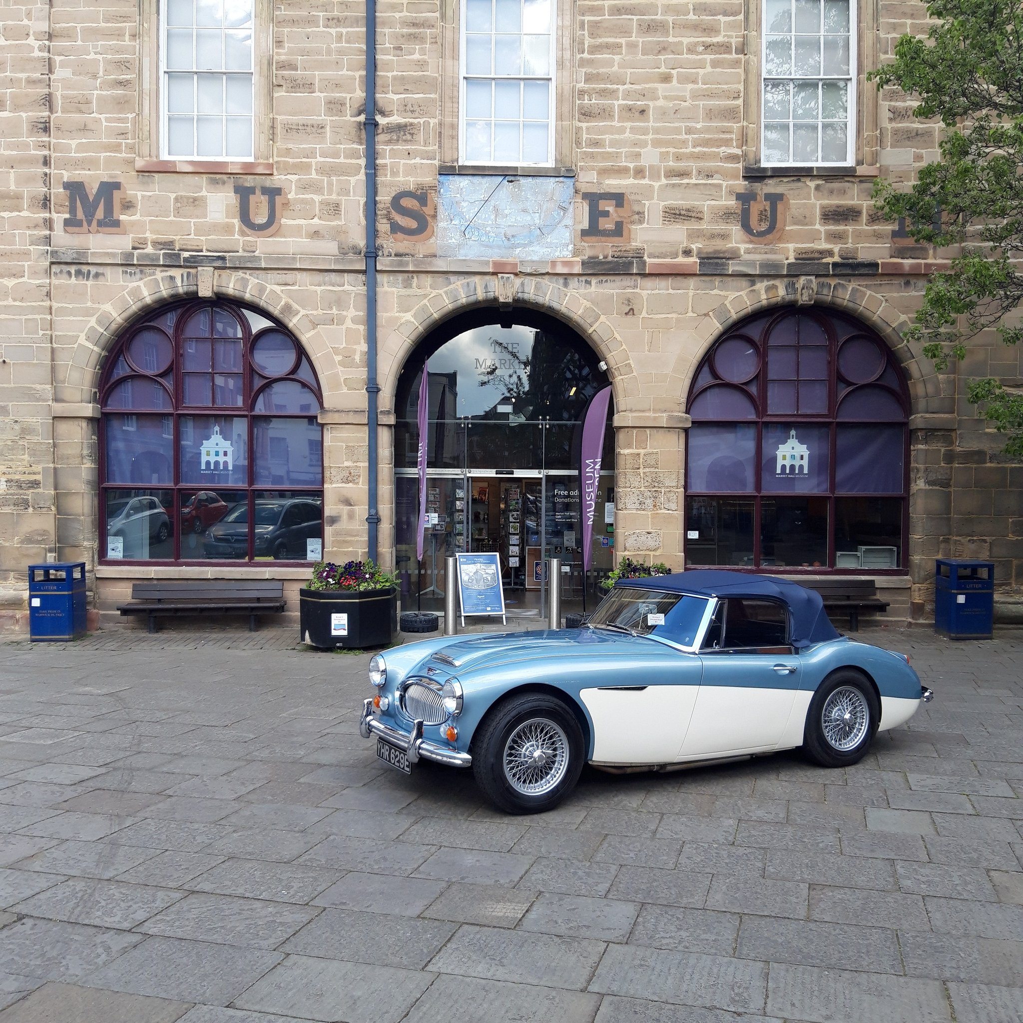 Healey car outside Market Hall Museum