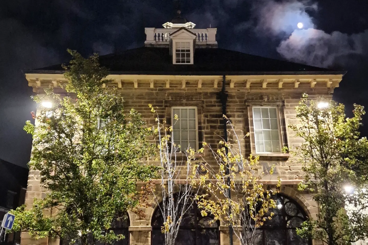 Photograph of Market Hall Museum in moonlight.