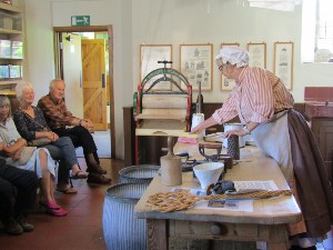 Someone demonstrating a past cooking technique