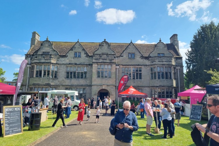 Image of a building with people in the foreground