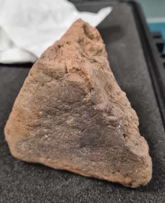 Fragment of iron age loom weight