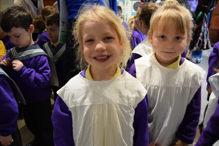 Image of children looking directly to camera